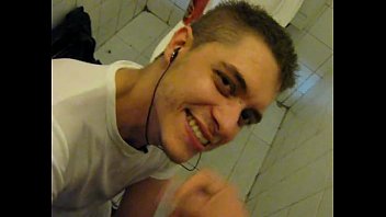 Spanish gay gives a blowjob in the bathroom