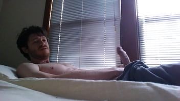  Hunky guy in sweats jerks and cums by the window!
