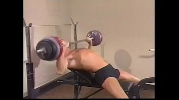  Darkhaired workout fanatic karl thomas explains newcomer member david griffin code of behavior in the club